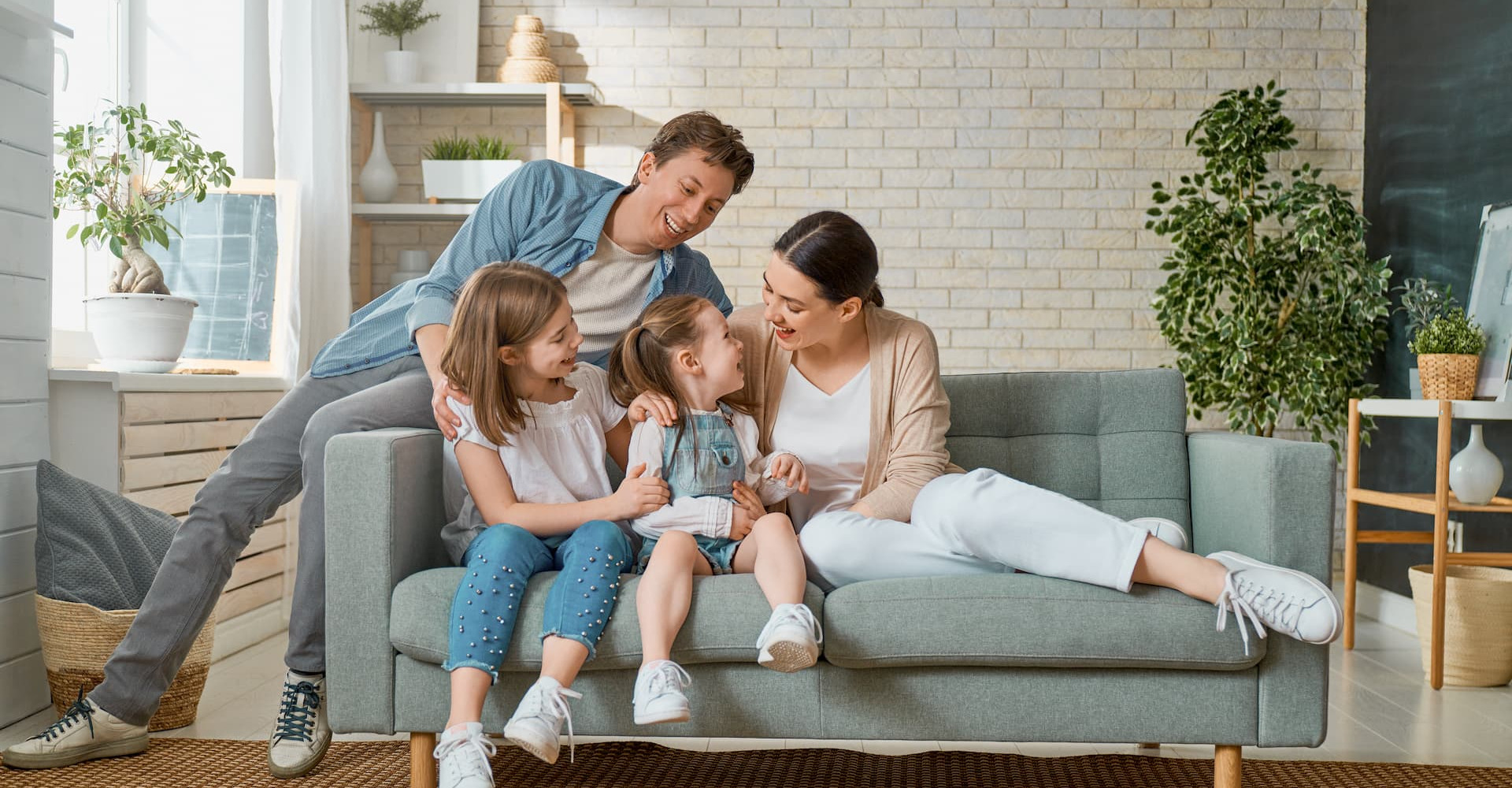 happy family sitting on a couch